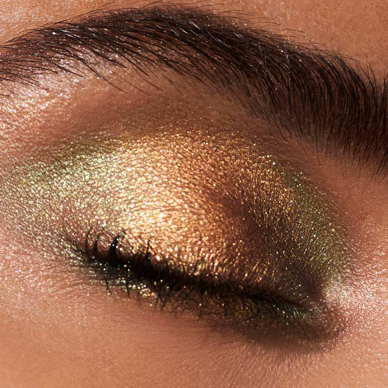 Bronze eyeshadow look from Lancôme x The Louvre Richelieu Wing Face & Eyeshadow Palette shown on a woman’s closed eye
